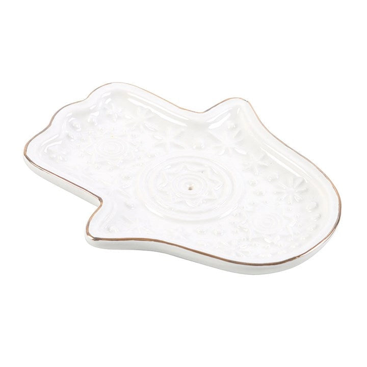 White ceramic Hamsa Hand incense holder with intricate embossed detailing, perfect for mindful rituals.