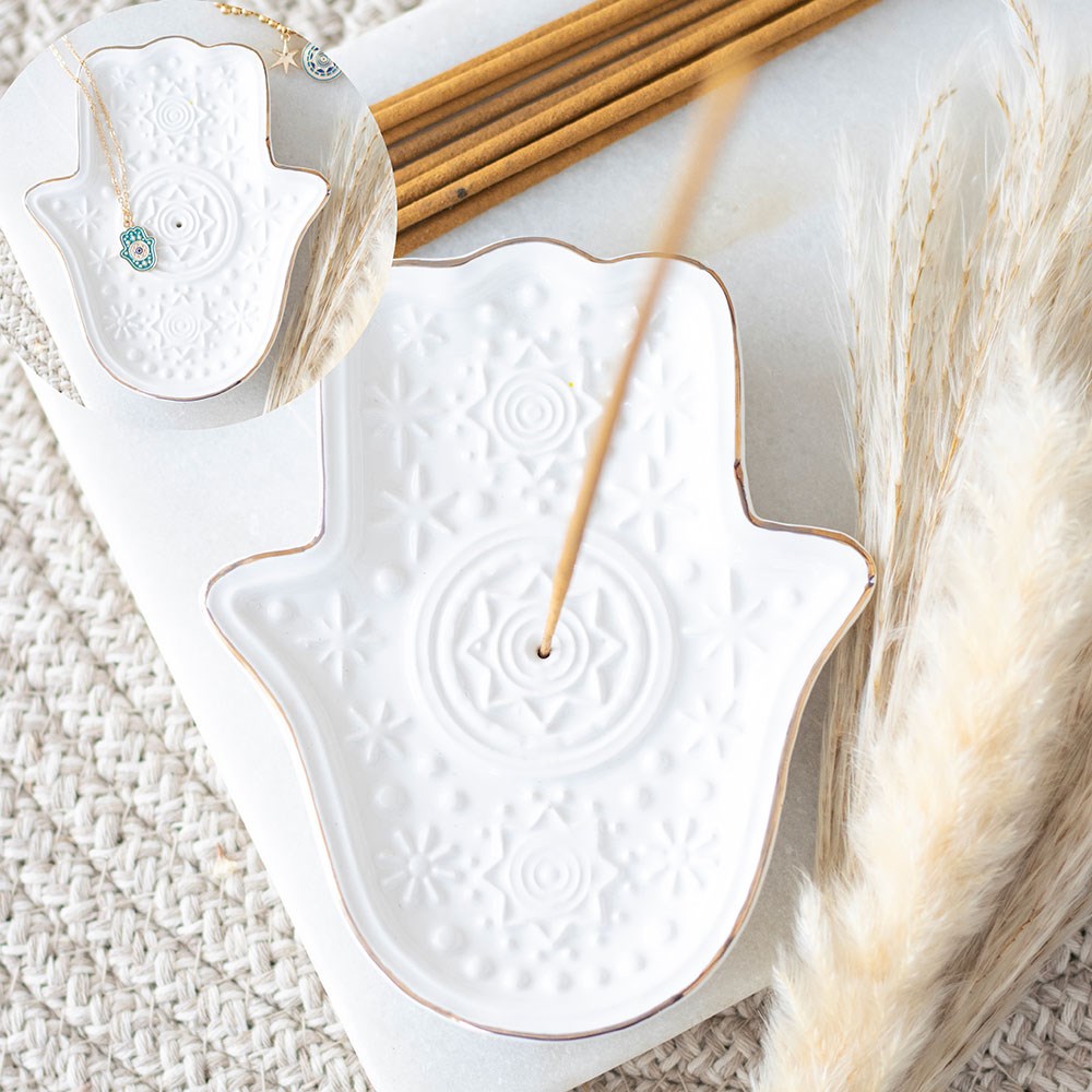 Top view of the white Hamsa Hand incense holder with detailed star pattern.