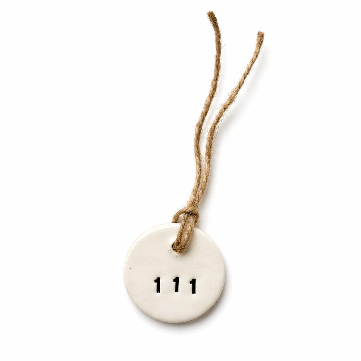 Handmade white round ceramic hanging tag with 111 angel number and natural jute twine