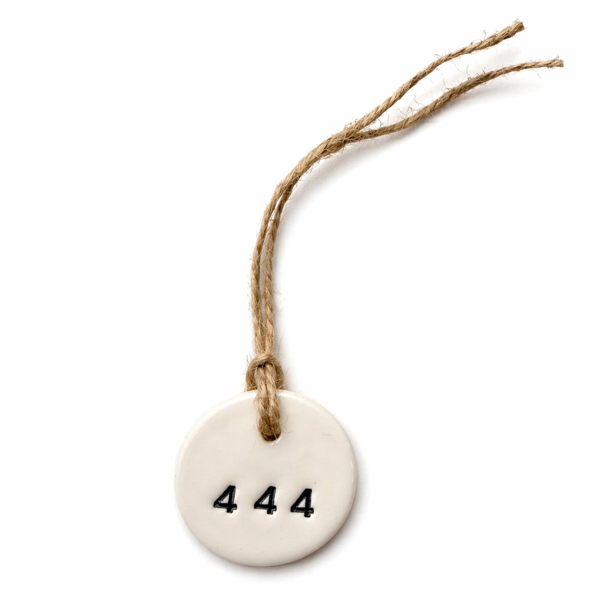 Handmade white round ceramic hanging tag with 444 angel number and natural jute twine
