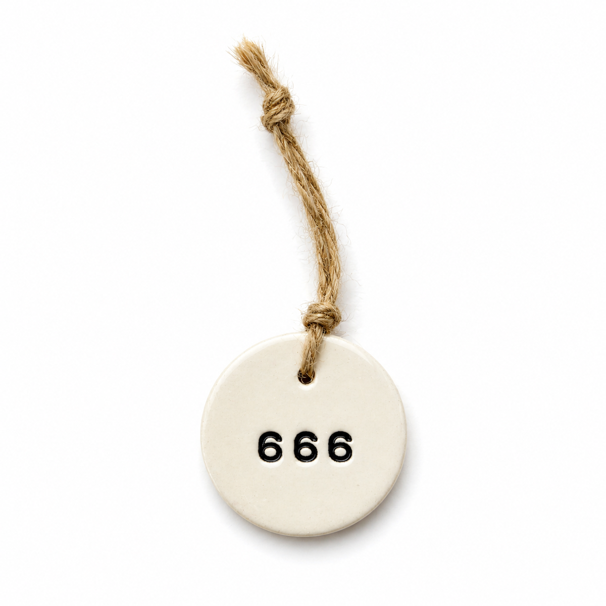 Handmade white round ceramic hanging tag with 666 angel number and natural jute twine