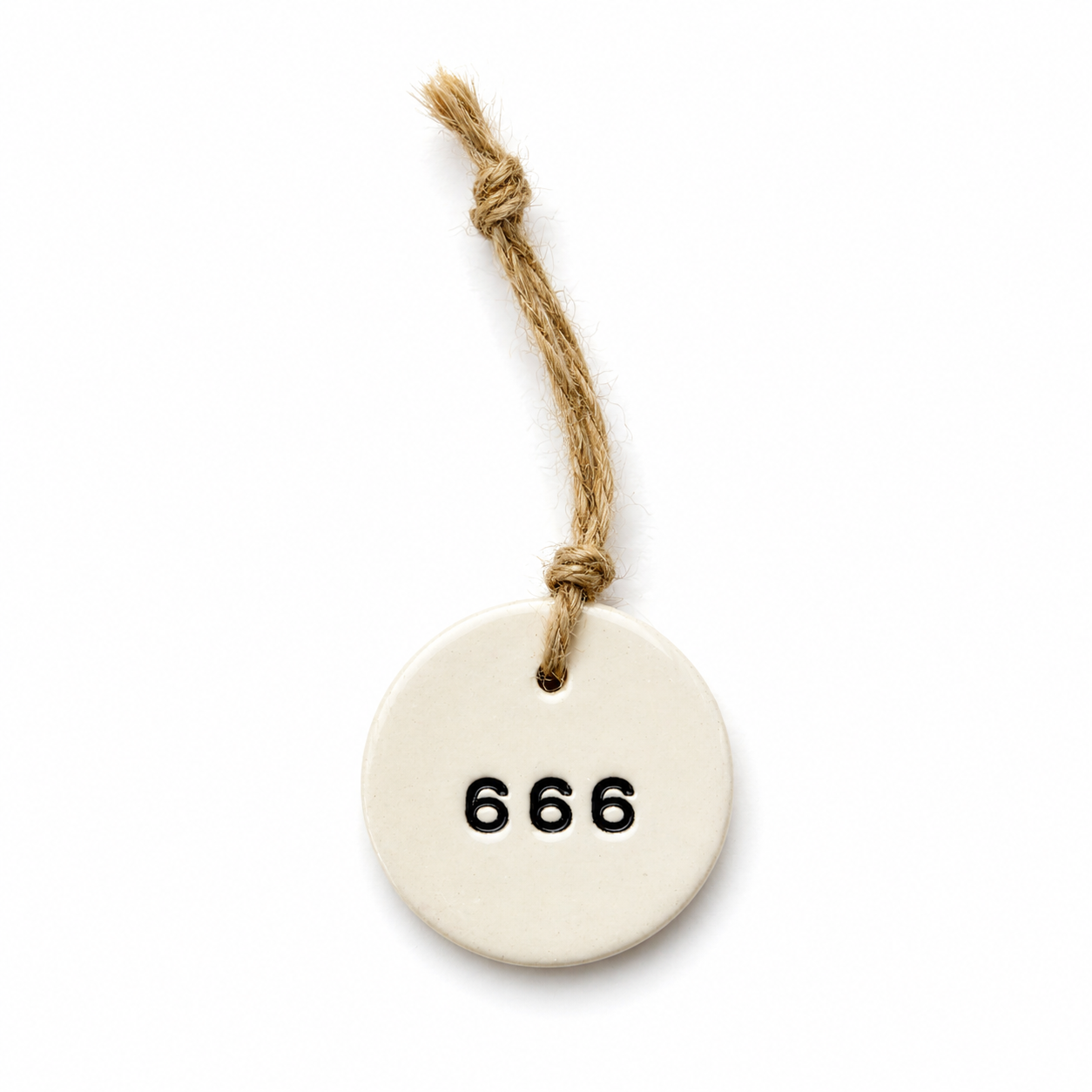 Handmade white round ceramic hanging tag with 666 angel number and natural jute twine