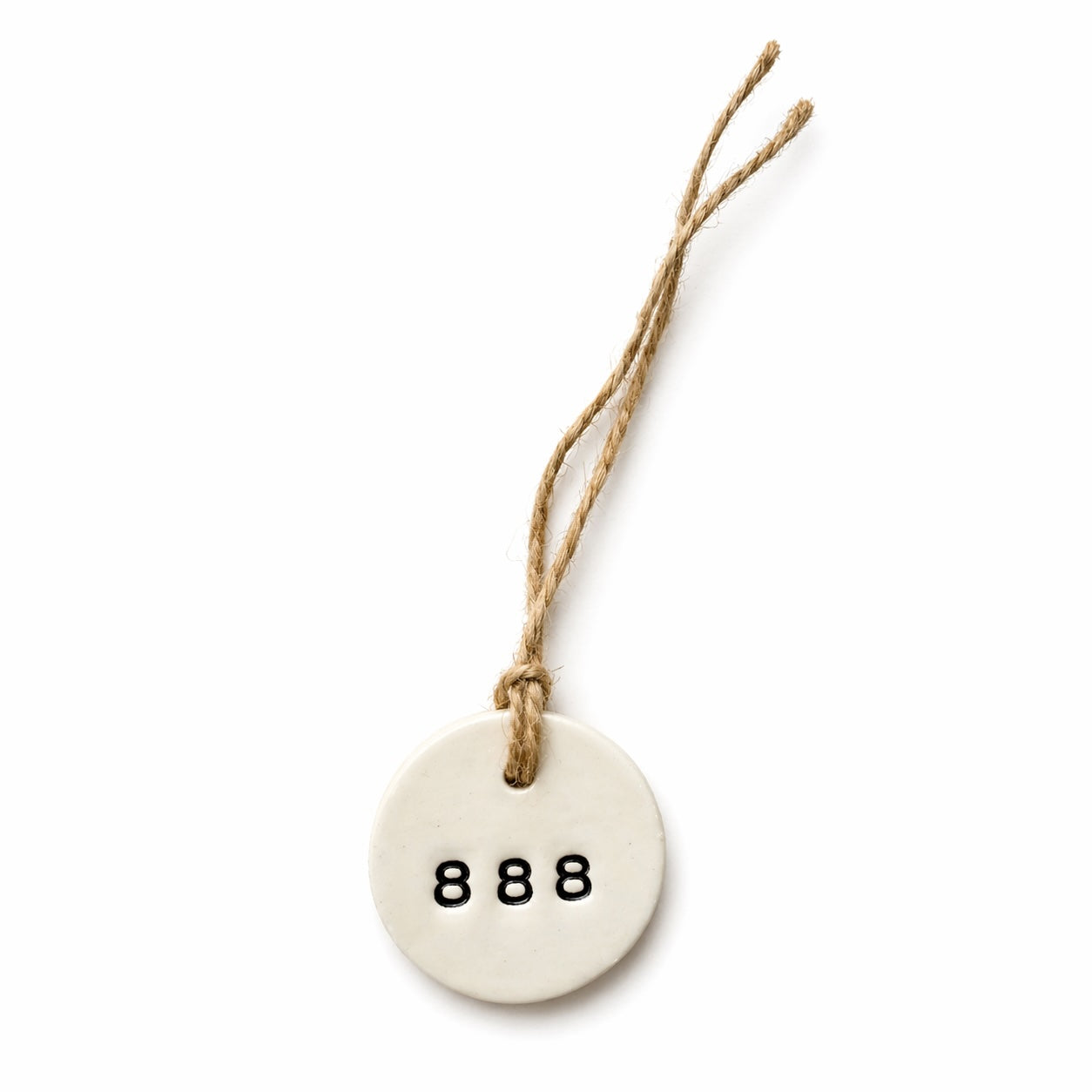 Handmade white round ceramic hanging tag with 888 angel number and natural jute twine