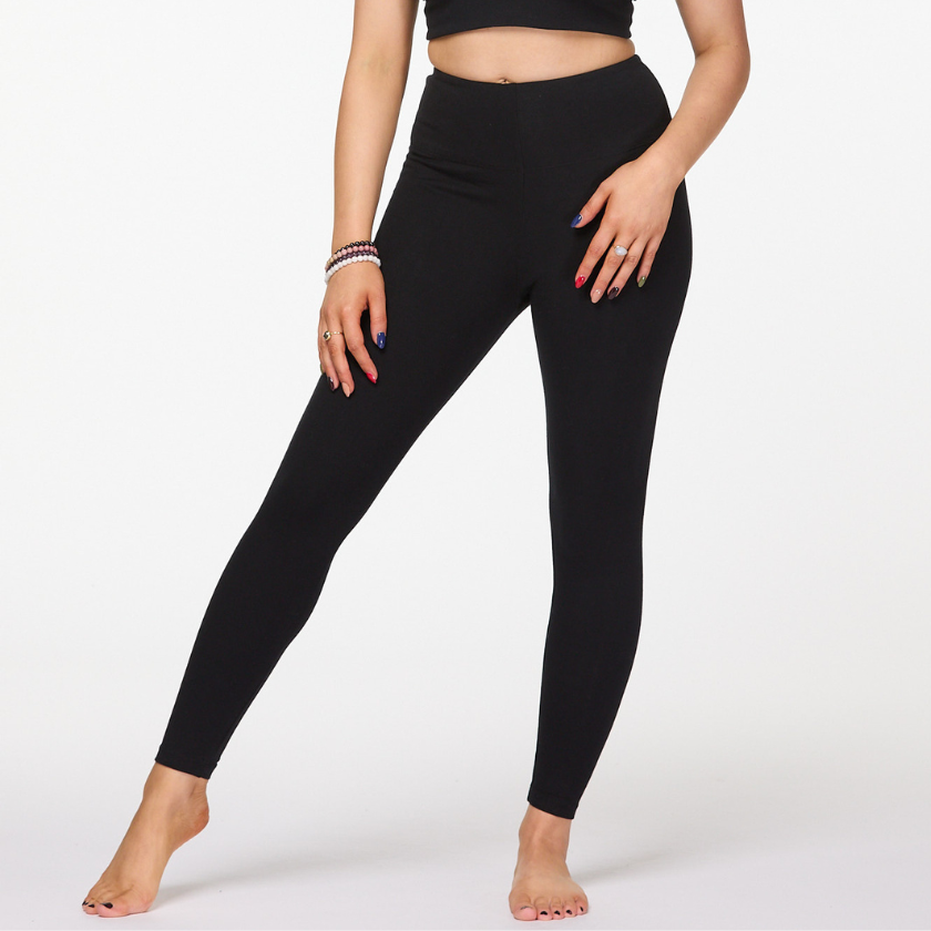 Close up of black full length high waisted cotton leggings showing smooth sculpted fit and waistband.
