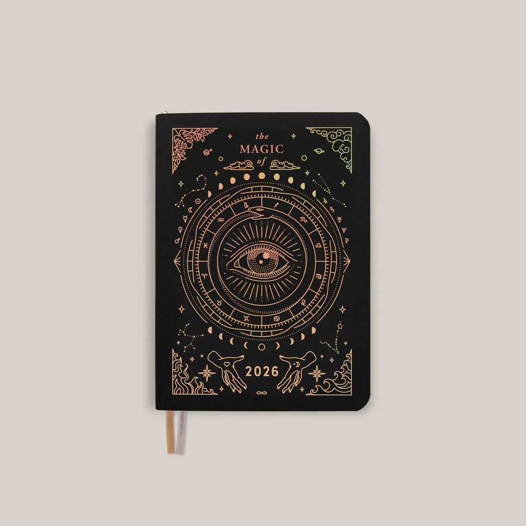 Front cover of the 2026 Astrological Pocket Planner Almanac & Guidebook in black with gold detailing