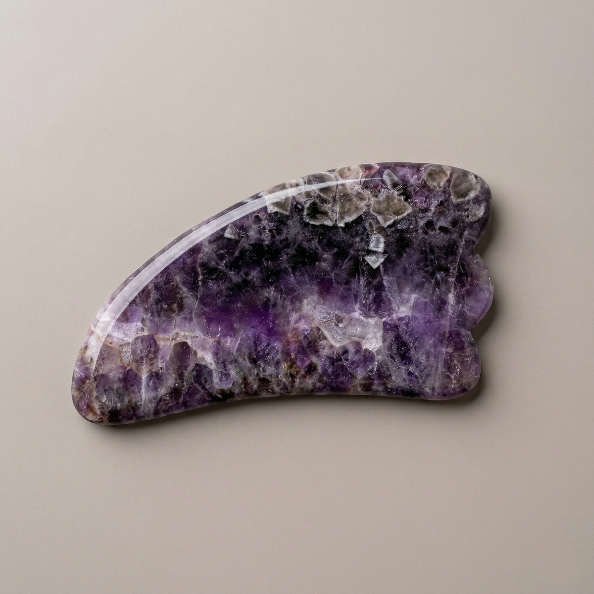 Natural amethyst gua sha facial massage tool for skincare and lymphatic drainage