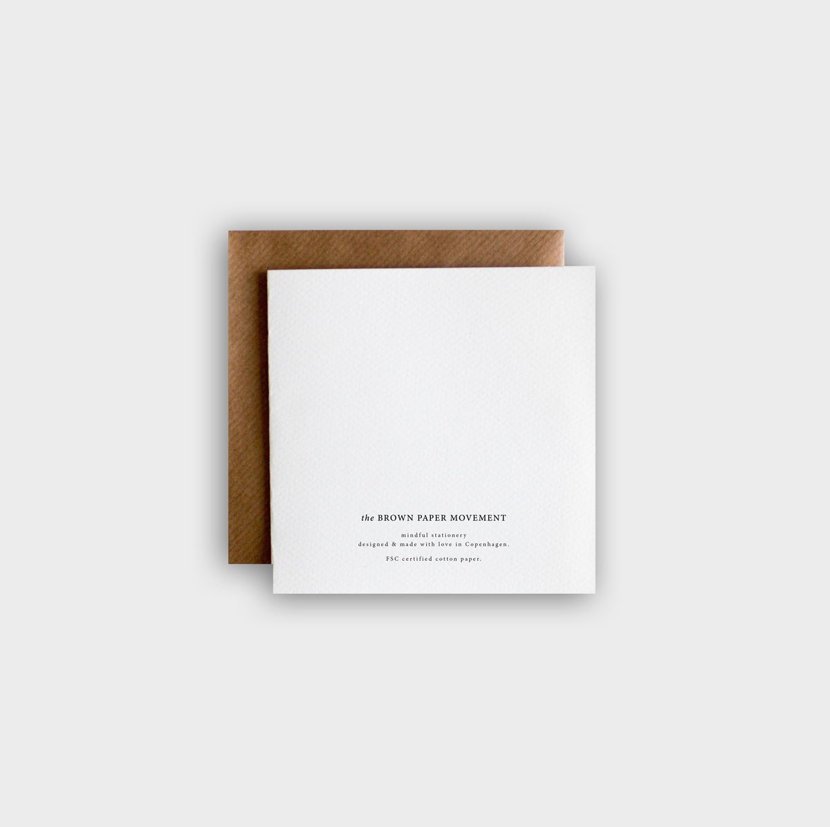 Back of greeting card printed on thick textured cotton pulp paper, minimalist style.