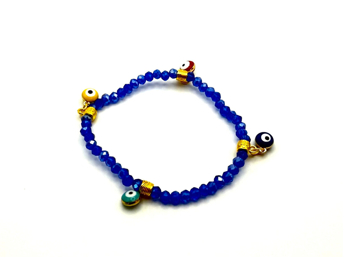 Beaded crystal Mati evil eye bracelet in Aqua Blue with gold plated accents.