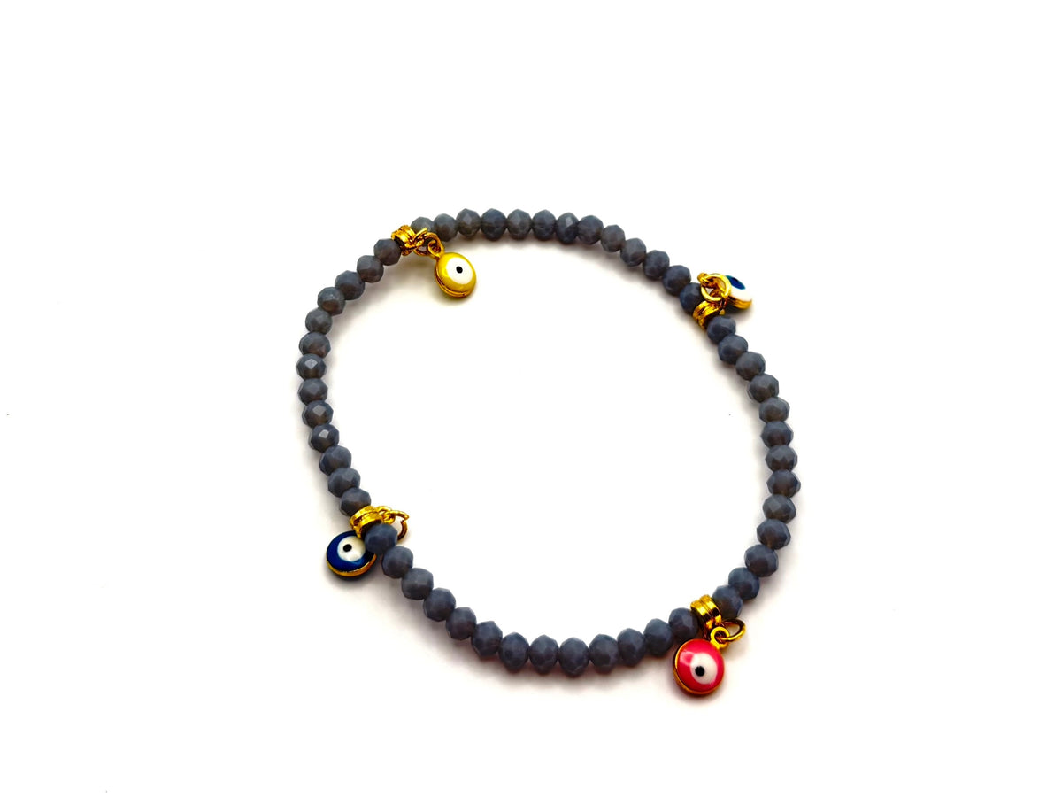 Beaded crystal Mati evil eye bracelet in Grey with gold plated accents.