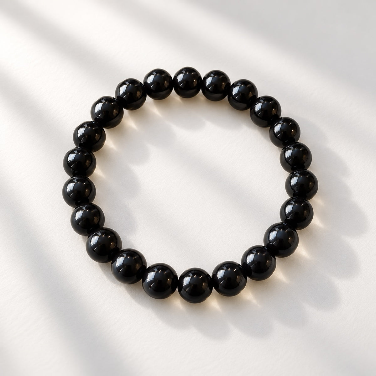 Black Obsidian beaded bracelet featuring 8 mm round black beads.