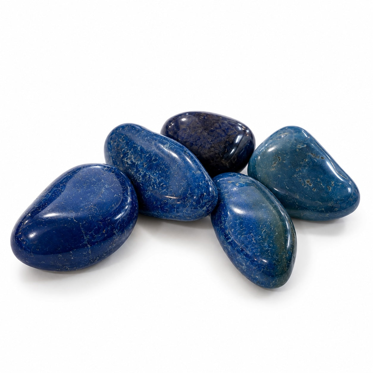 Polished Blue Agate tumble stone from Brazil showing natural-looking blue colour and agate patterns.