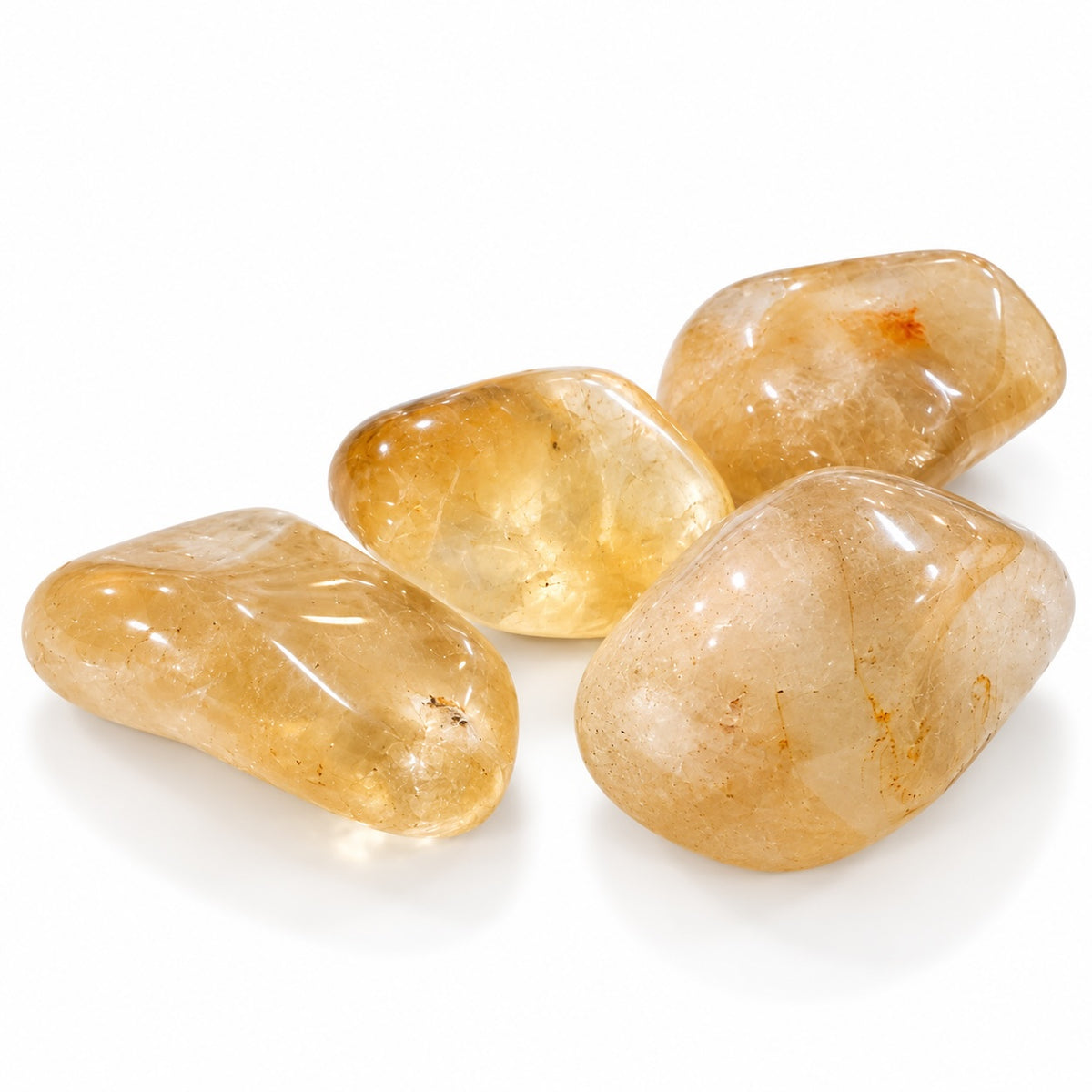 Citrine tumble stone with golden yellow tones.
