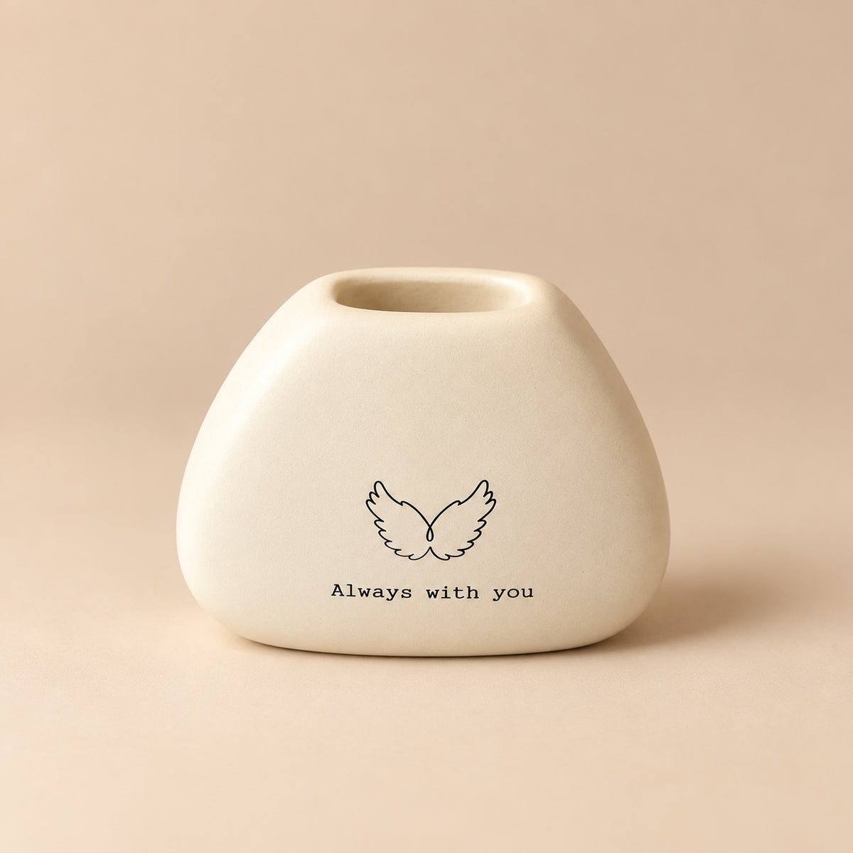 Small rounded cream mini resin vase with black angel wings illustration and “Always with you” lettering.