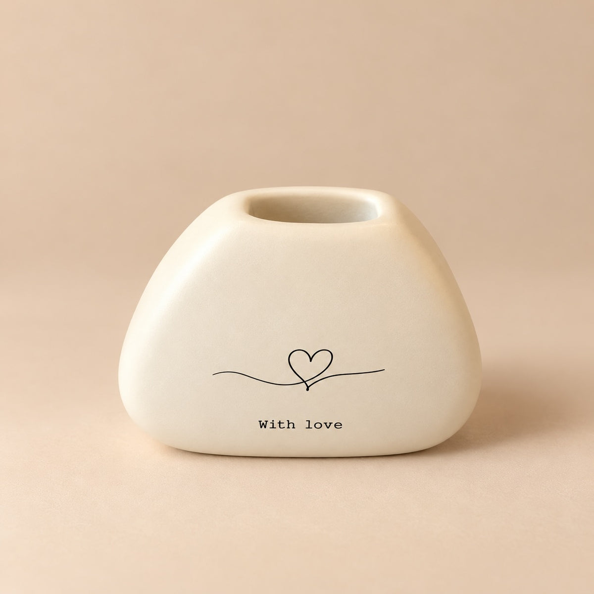 Small rounded cream resin mini vase with a black continuous line heart illustration and “With love” lettering.