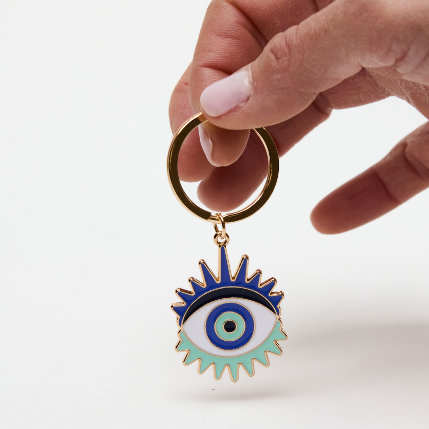 Evil Eye keyring in blue and gold symbolising luck and protection
