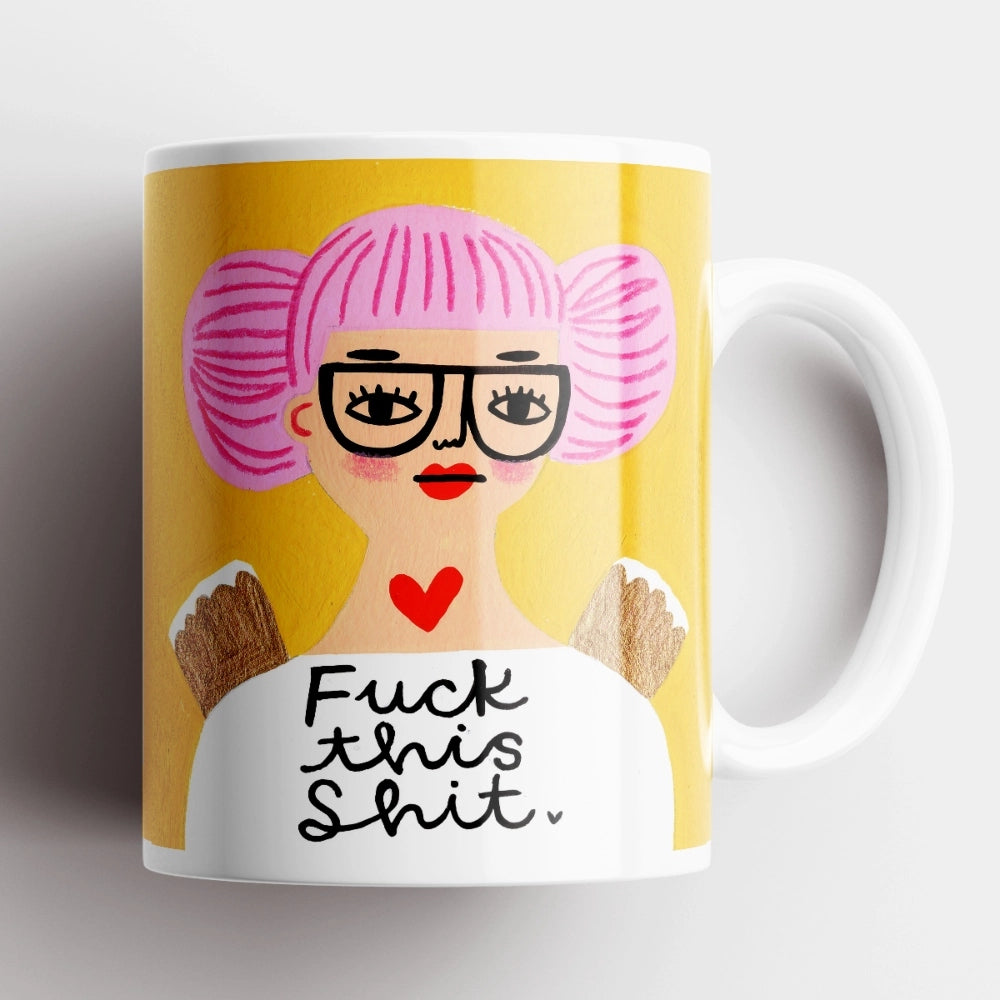 Fuck This Shit Grumpy Angel Mug – ceramic mug with illustrated angel and pink hair on yellow background.