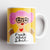 Fuck This Shit Grumpy Angel Mug – ceramic mug with illustrated angel and pink hair on yellow background.