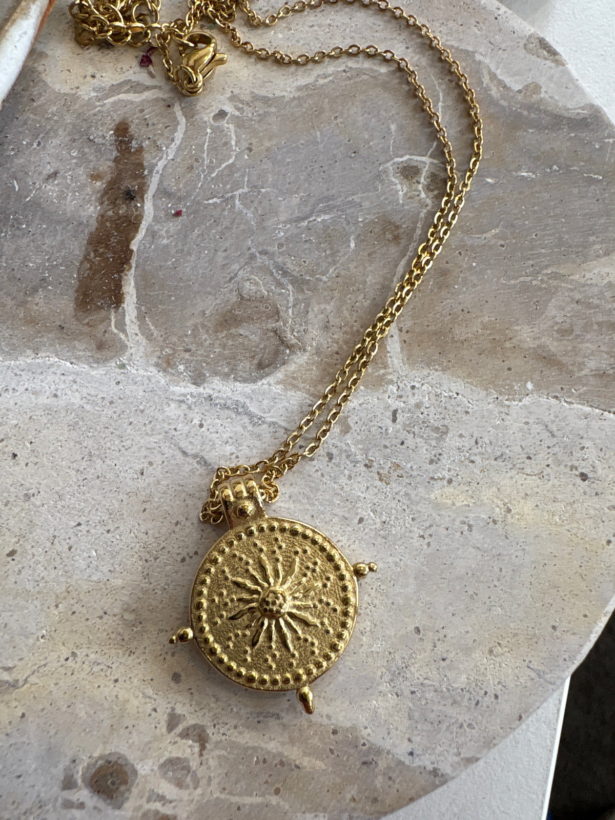 Close-up of Luna &amp; Soul Guiding Sun Necklace showing detailed sun design