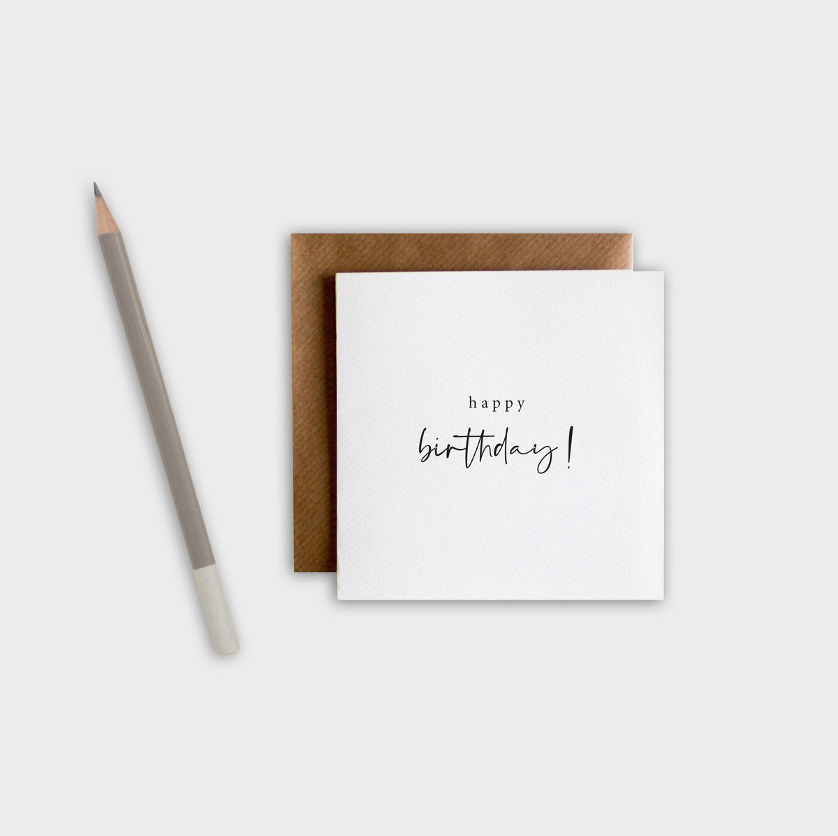 Minimalist Happy Birthday greeting card on thick textured cotton pulp paper with brown envelope.