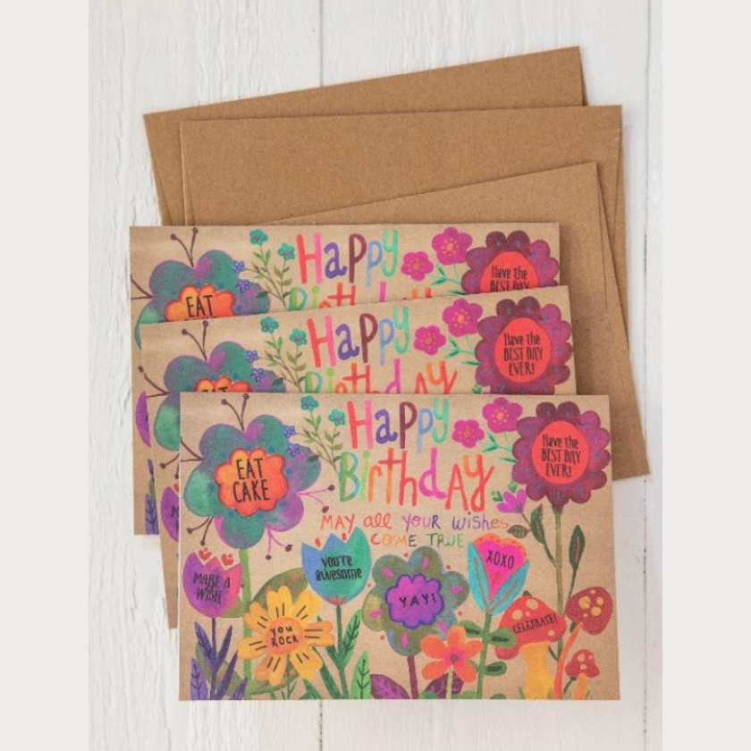 Floral Happy Birthday greeting card with recycled kraft envelope and colourful hand-drawn flowers on brown background