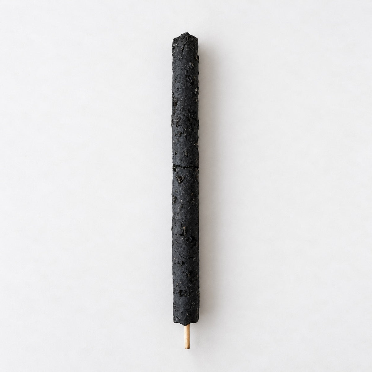 Four Palo Santo sticks bundled with a cream printed ribbon, shown on a neutral background.