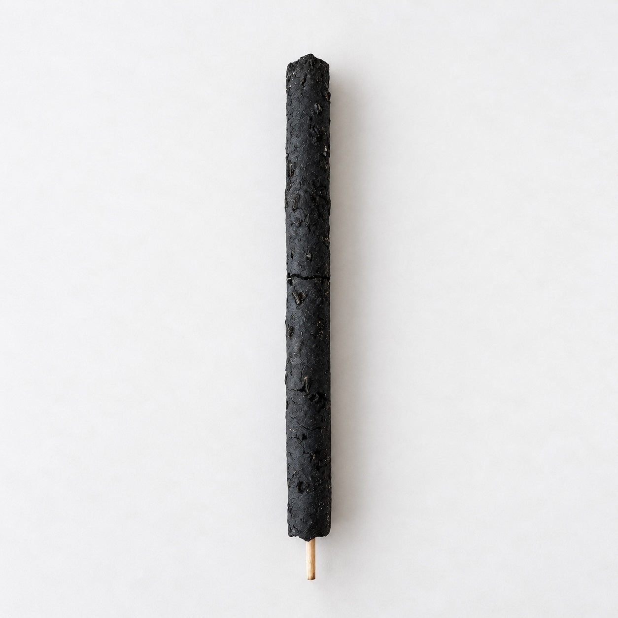 Four Palo Santo sticks bundled with a cream printed ribbon, shown on a neutral background.