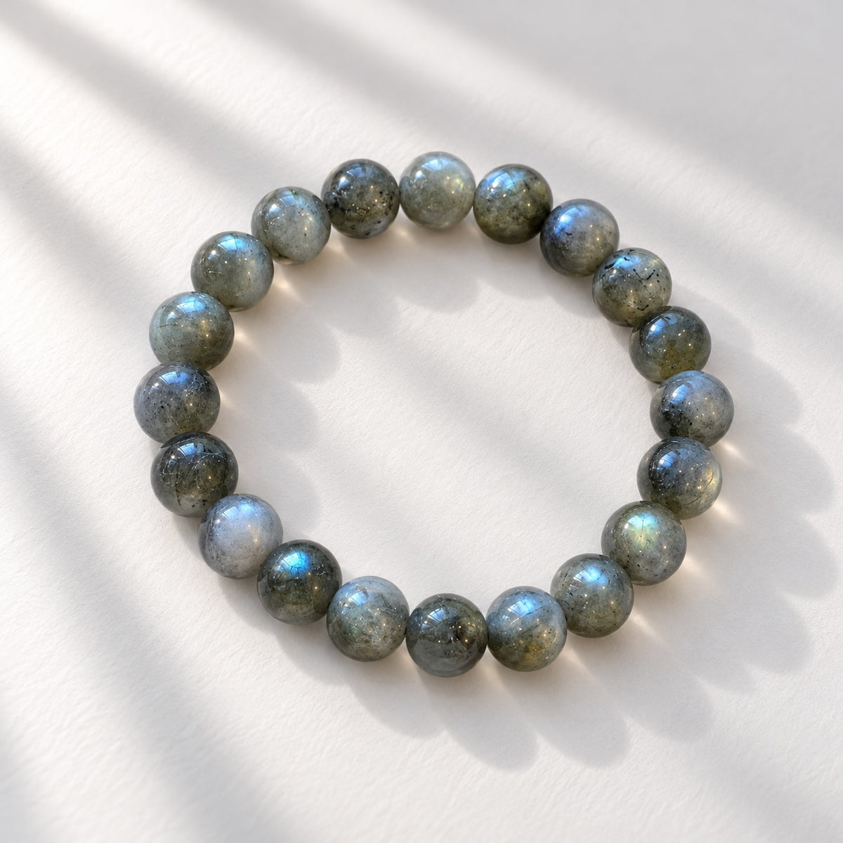 Labradorite beaded bracelet with 10 mm round grey-toned gemstone beads. Confirm visible colour flashes,