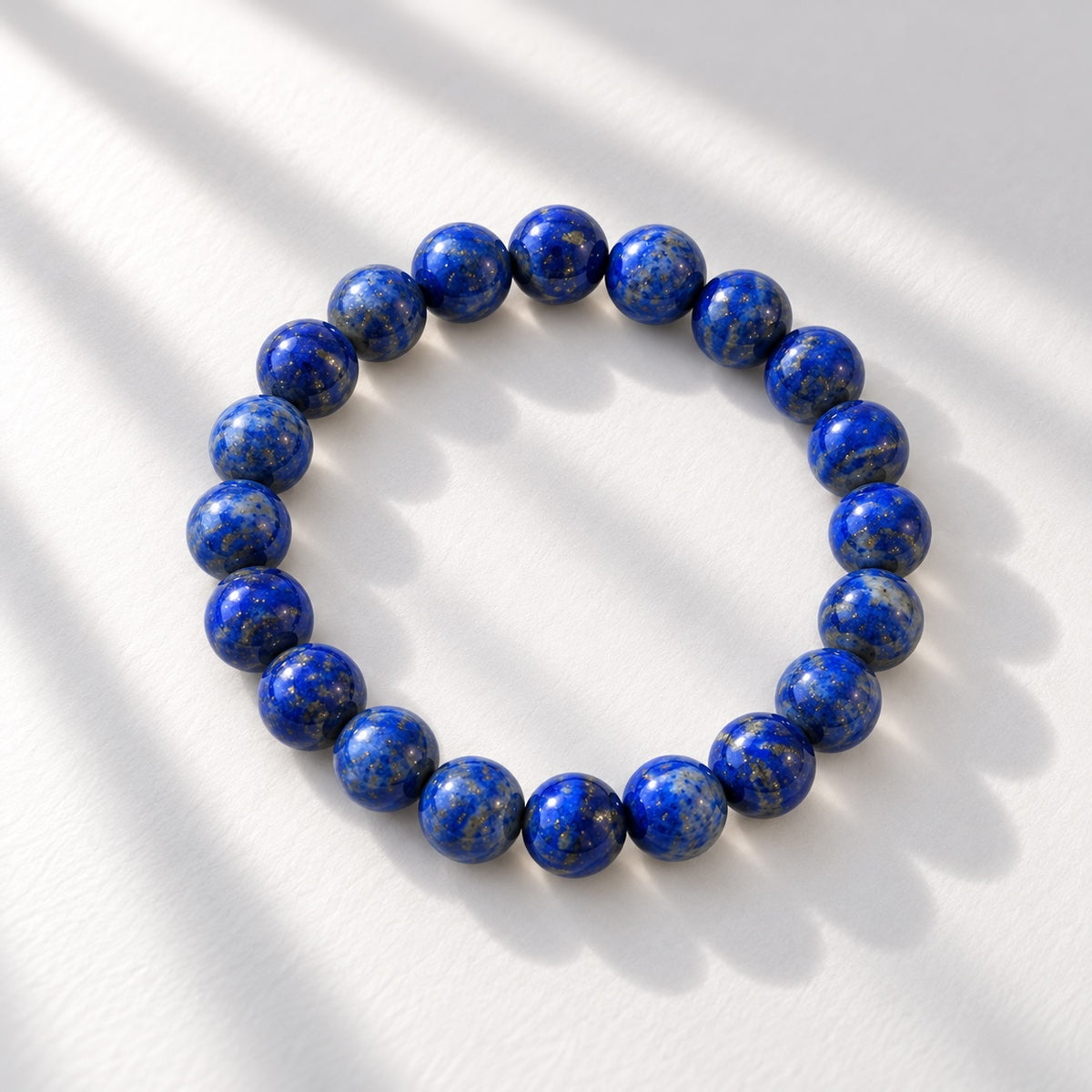 Lapis Lazuli beaded bracelet featuring 10 mm round blue beads.