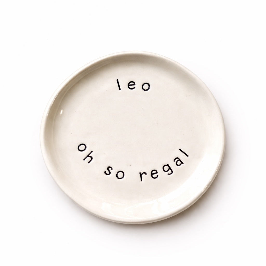 Handmade Leo zodiac ceramic plate with full of passion text in glazed earthenware
