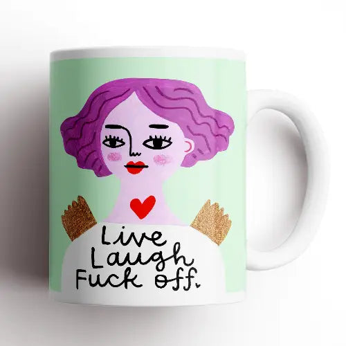Live Laugh F** Off Grumpy Angel Mug* – funny ceramic mug with purple-haired angel illustration on mint background.