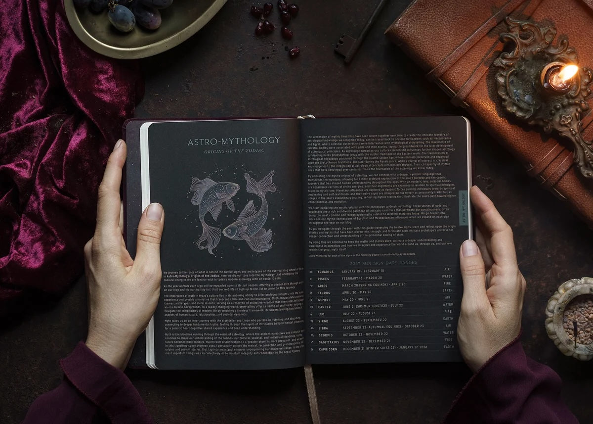 Interior pages of Magic of I 2027 Astrological Planner showing moon journalling and astro-mythology spreads.