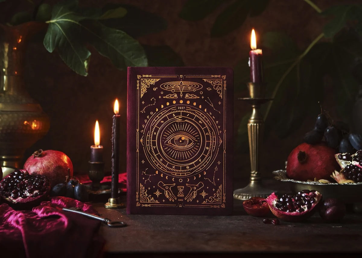 Magic of I 2027 Astrological Planner in Pomegranate Velvet with gold foil cover on white background.