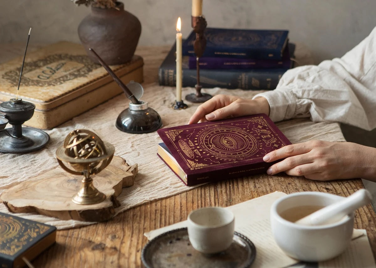 Magic of I 2027 Pomegranate Astrological Planner styled in a mindful planning ritual setting.