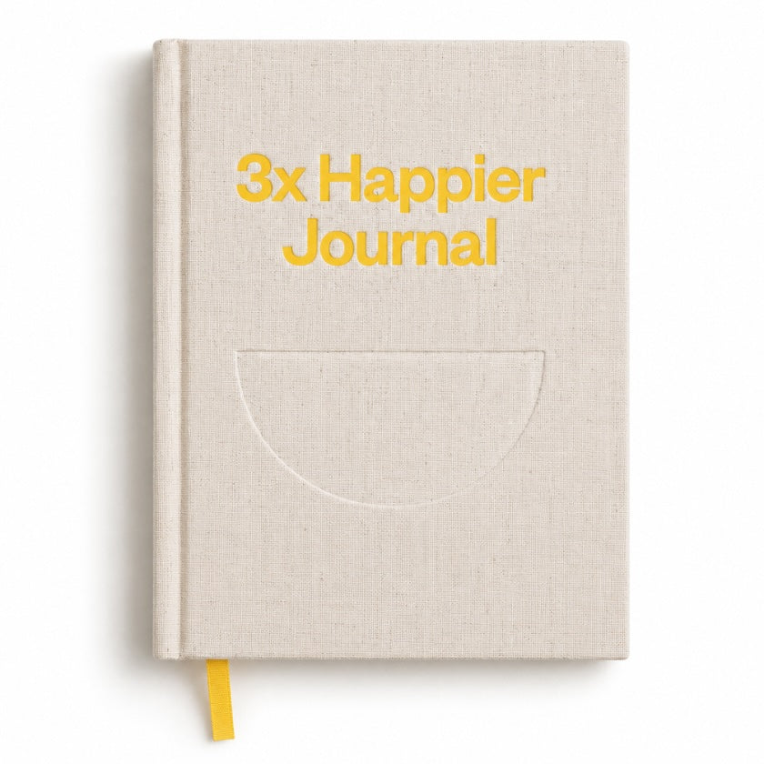 Natural linen hardcover “3x Happier Journal” with minimalist design, yellow lettering and ribbon bookmark.
