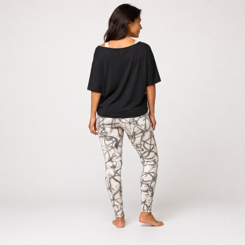 Luna &amp; Soul abstract grey print leggings in back view with relaxed black top