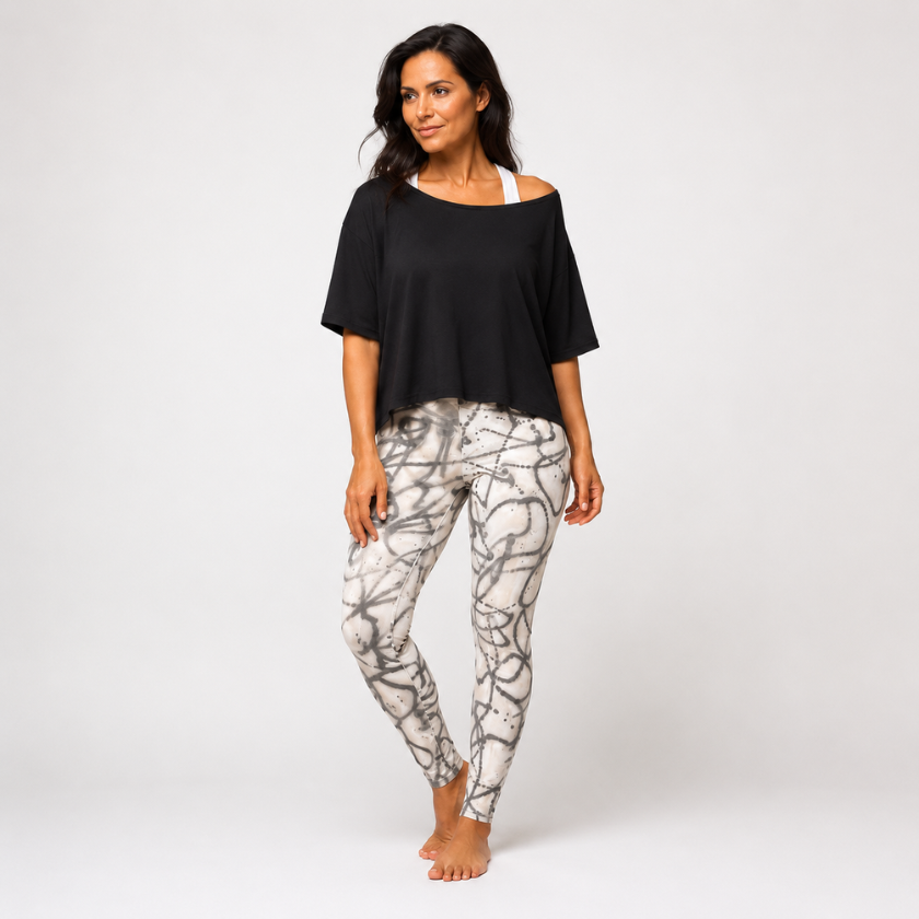 Luna &amp; Soul abstract grey print leggings in front view with black cropped top