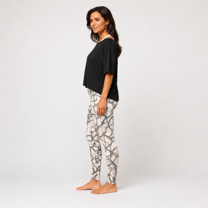 Side view of Luna &amp; Soul abstract grey print leggings with black cropped top