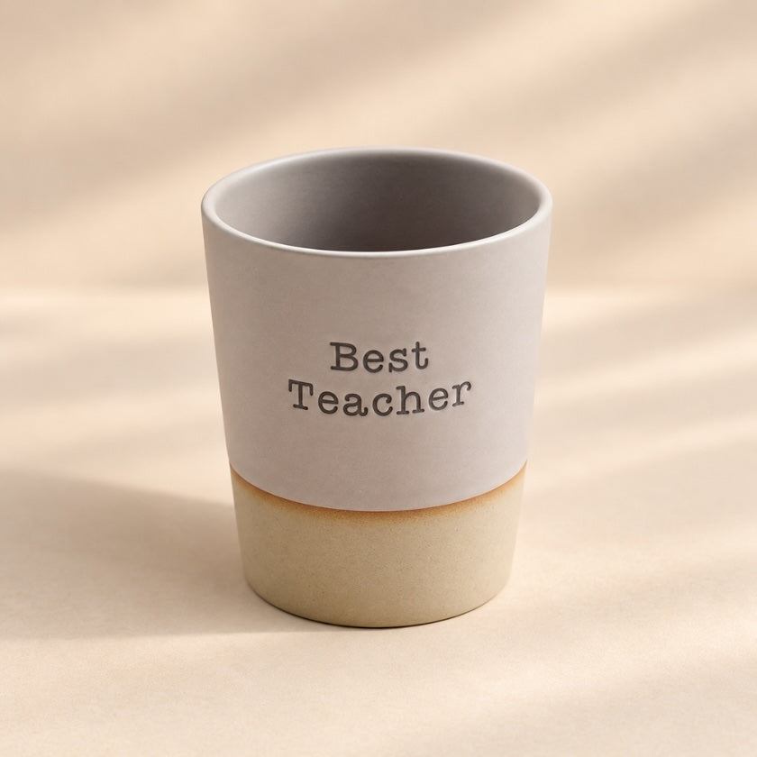 Best Teacher hand-glazed ceramic mug in soft grey with natural-toned base.
