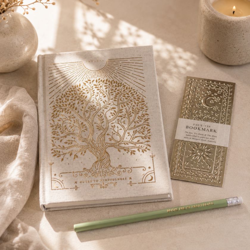 Luna &amp; Soul Books Are My Happy Place pencil styled beside a journal as a thoughtful gift for book lovers.