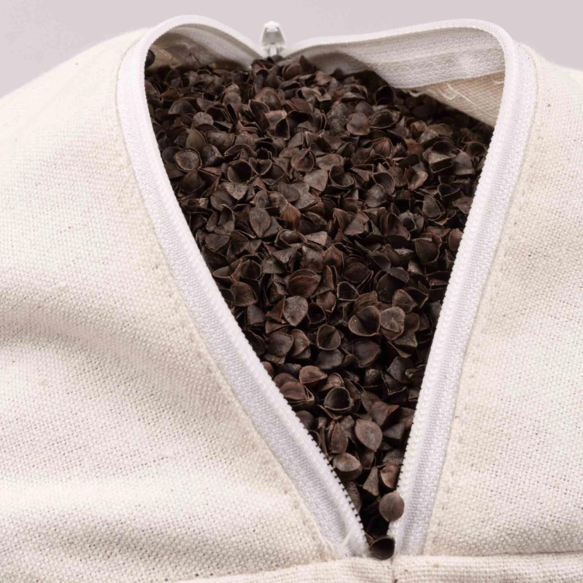Close up of buckwheat shell filling inside Luna and Soul yoga bolster showing natural filling material