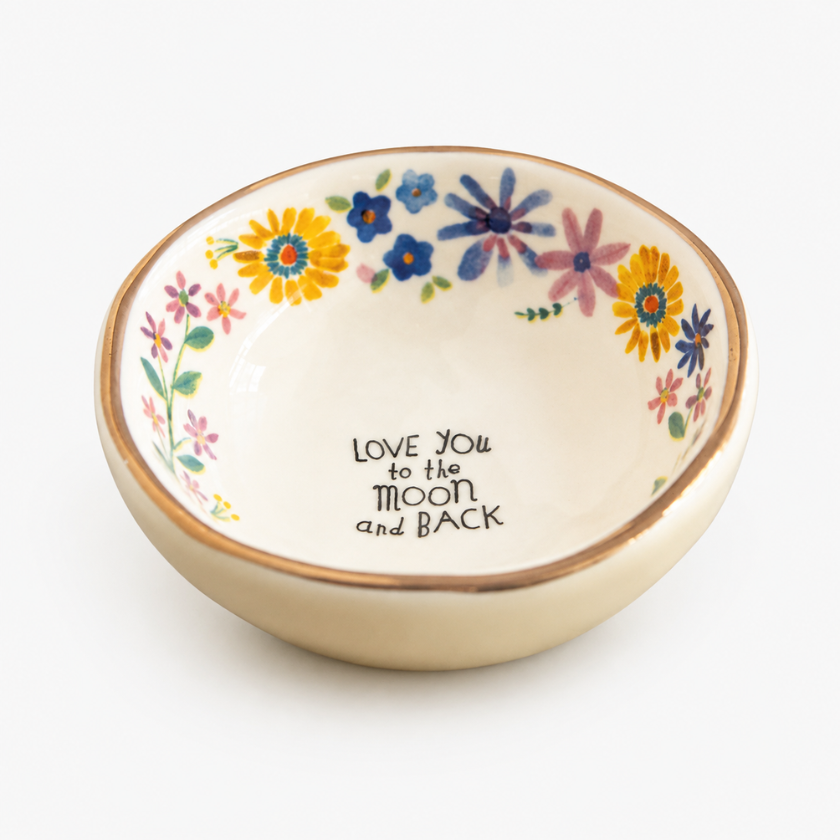 Front angle of Luna & Soul Love You To The Moon And Back bowl in cream floral — ceramic trinket bow