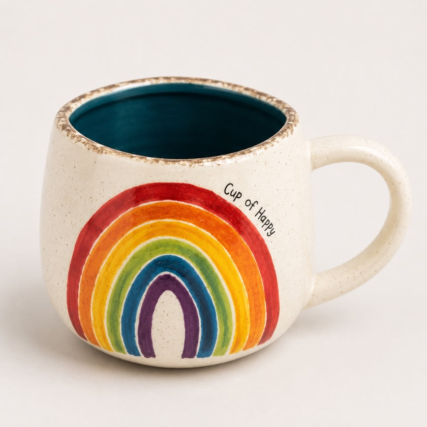 Speckled ceramic mug with colourful rainbow design, deep blue interior and “Cup of Happy” text.