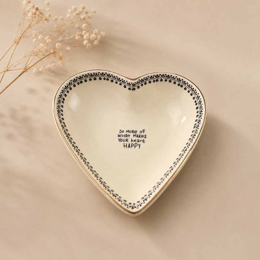 Luna &amp; Soul heart-shaped ceramic trinket dish with the message "Do more of what makes your heart happy" and a delicate black floral border.