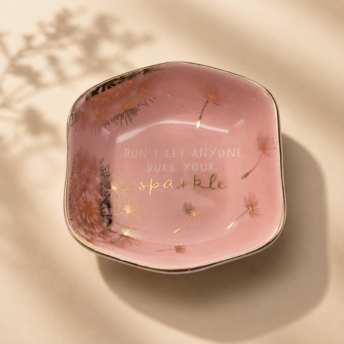 Luna &amp; Soul blush pink ceramic trinket dish with dandelion illustrations and the quote "Don't Let Anyone Dull Your Sparkle".