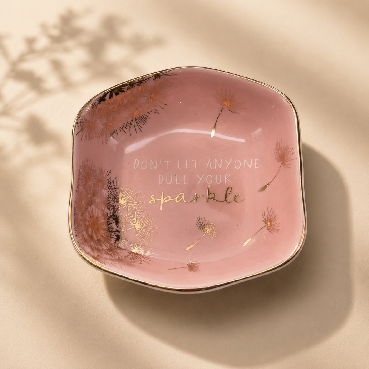 Luna & Soul blush pink ceramic trinket dish with dandelion illustrations and the quote "Don't Let Anyone Dull Your Sparkle".