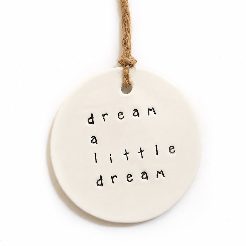 Luna and Soul Dream A Little Dream handmade ceramic tag with jute twine on white background.