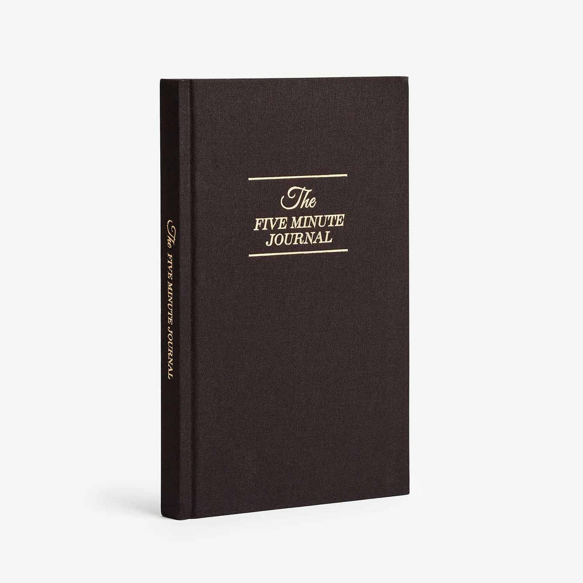 The Five Minute Journal in black with gold cover lettering.