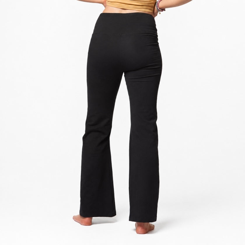 Woman wearing black organic cotton flare leggings with high waisted fit, Luna &amp; Soul Australia.