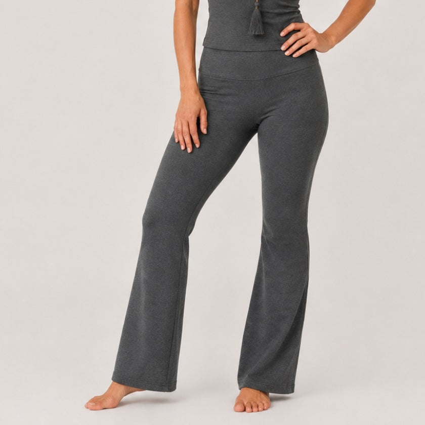 Woman wearing dark grey organic cotton flare leggings with high waisted fit, Luna &amp; Soul Australia.