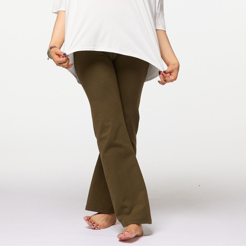 Woman wearing khaki organic cotton flare leggings with high waisted fit, Luna &amp; Soul Australia.